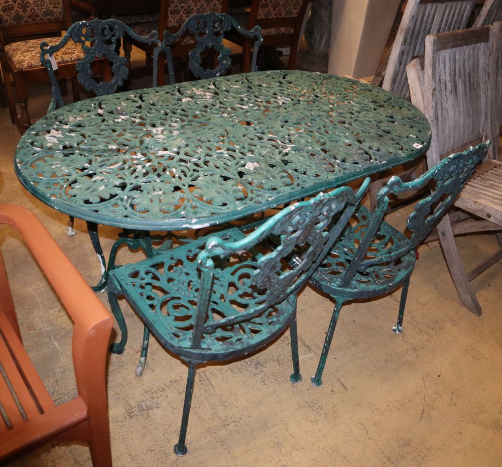 A painted metal garden table, W.136cm, D.76cm, H.68cm, bench seat and two chairs